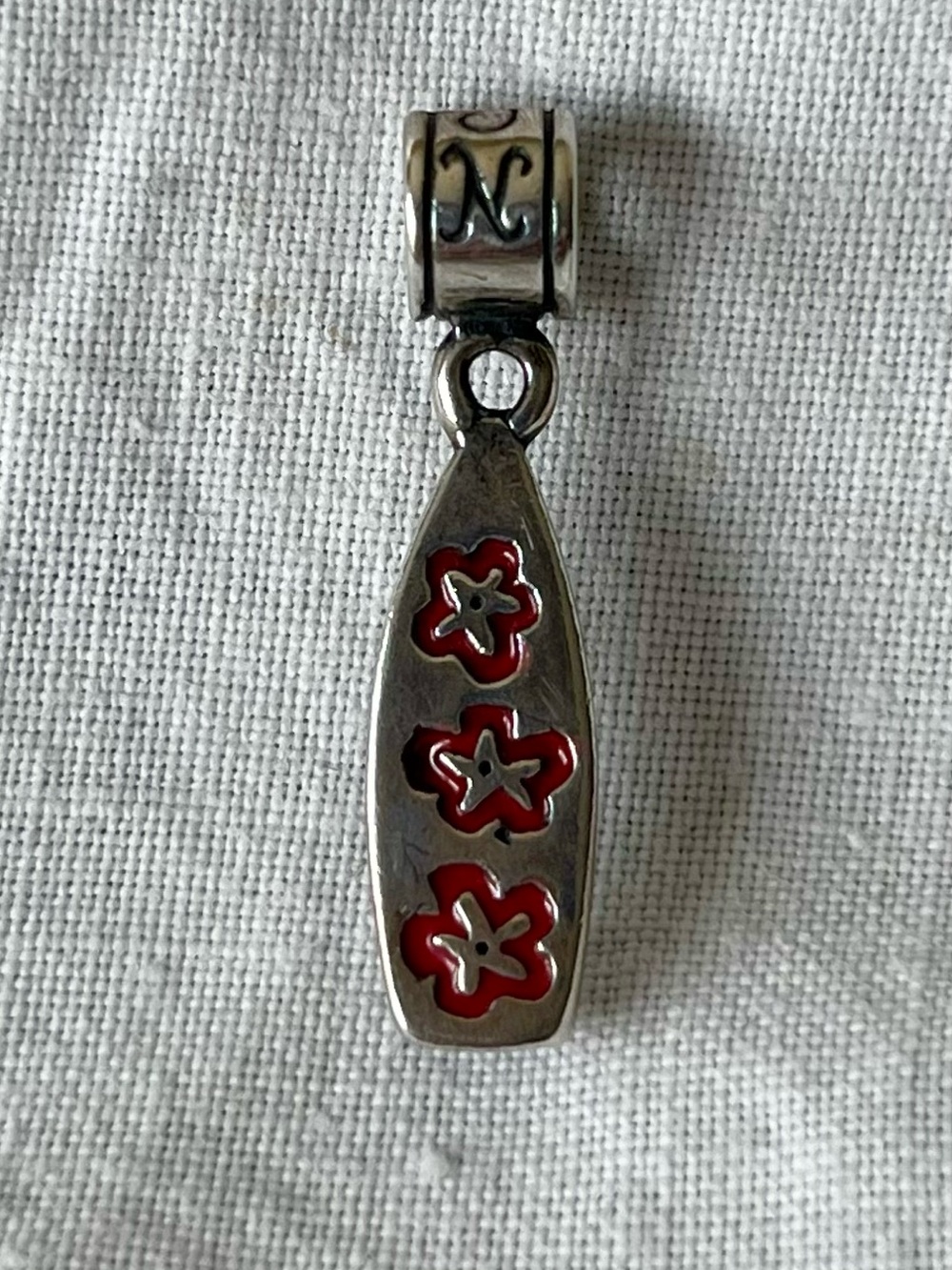Nomades .925 Sterling Silver surfboard “Camp Pendleton” charm